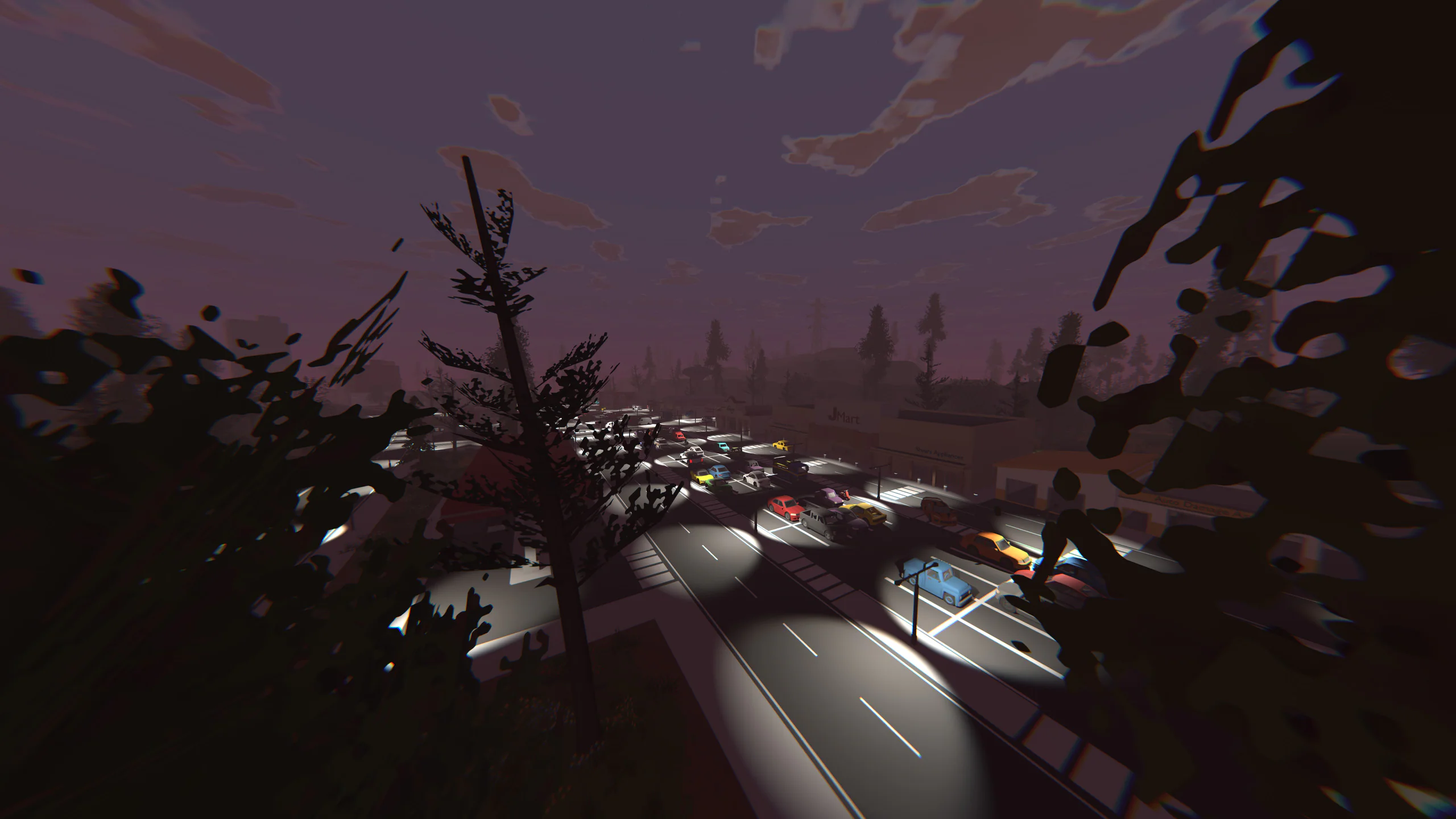 Motion-blurred dusk shot of cars queued on a tree-lined highway
