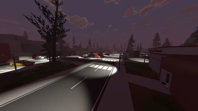 Night highway scene: cars with headlights on a curving road beside a red-lit building
