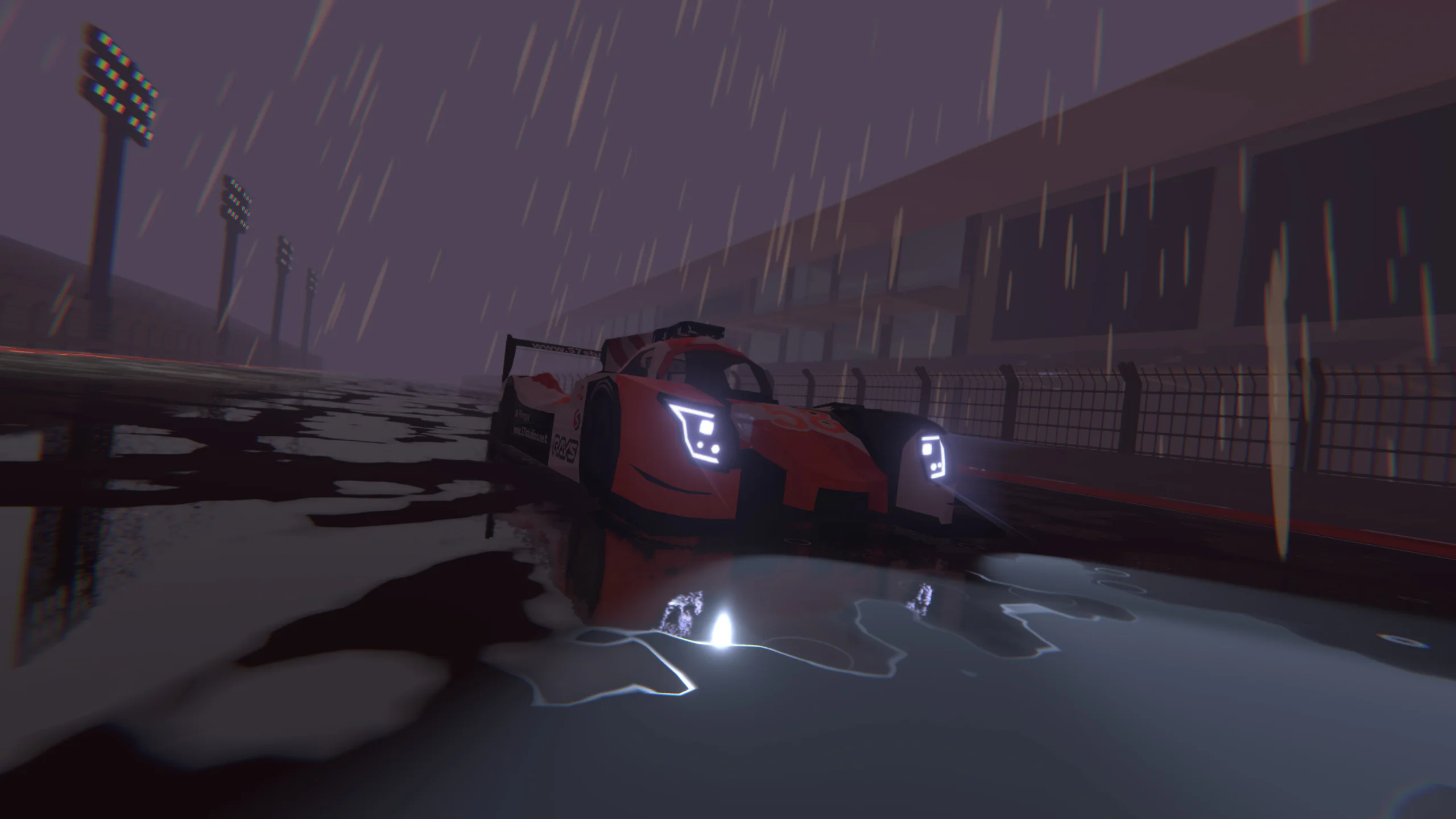 Rainy night pit lane: a race car's headlights glow under stadium lighting